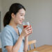woman-drinking-tomato-juice-before-meal-1